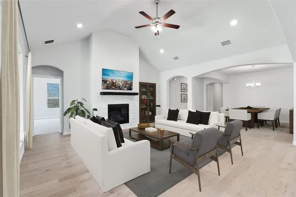 a bathroom with a shower sink and mirror