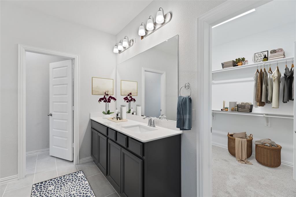 715 Soprano Drive Forney, TX 75126 - Photo 10 of 16 a bathroom with a sink double vanity and a mirror