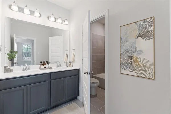 an aerial view of a residential houses with outdoor space and street view