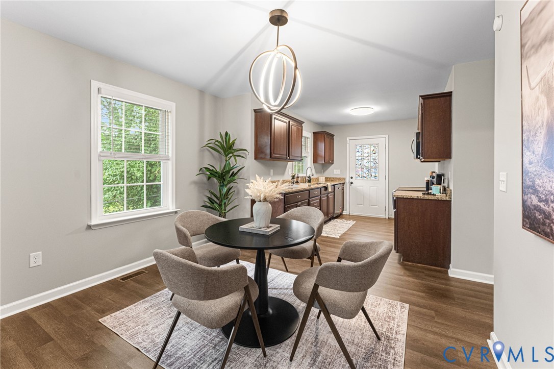 829 Rome Street Petersburg, VA 23803 - Photo 6 of 22 a view of a dining room with furniture window and wooden floor