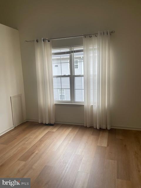 9200 Old Newtown Road Philadelphia, PA 19115 - Photo 24 of 36 an empty room with wooden floor and windows