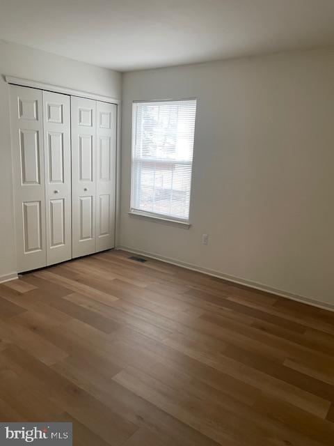 9200 Old Newtown Road Philadelphia, PA 19115 - Photo 25 of 36 an empty room with wooden floor and windows
