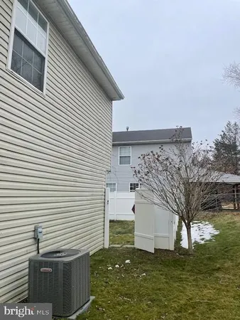 a view of a patio with a yard