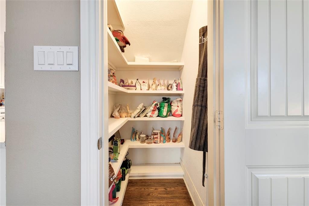 828 Elsbeth Street Dallas, TX 75208 - Photo 15 of 35 a walk in closet with wooden floor