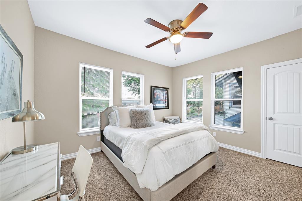 828 Elsbeth Street Dallas, TX 75208 - Photo 25 of 35 a bedroom with a large bed and a window