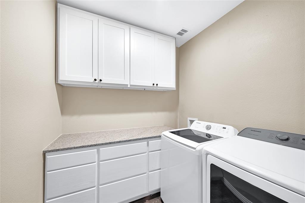 828 Elsbeth Street Dallas, TX 75208 - Photo 27 of 35 a utility room with dryer and washer