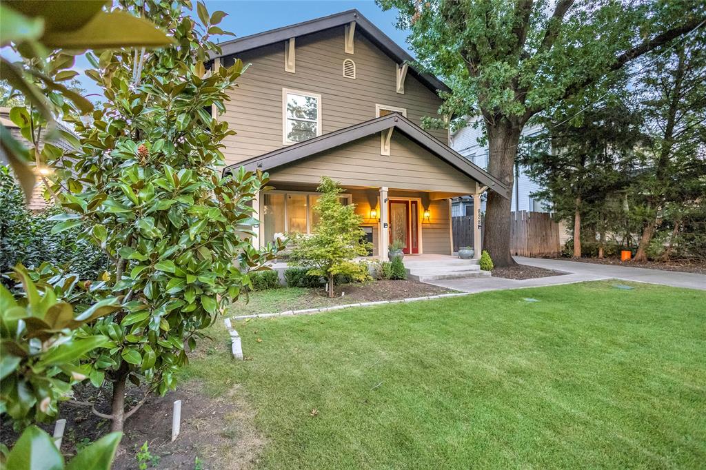 828 Elsbeth Street Dallas, TX 75208 - Photo 33 of 35 a front view of a house with a yard and porch