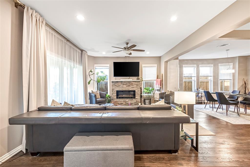 828 Elsbeth Street Dallas, TX 75208 - Photo 6 of 35 a living room with fireplace furniture and a flat screen tv