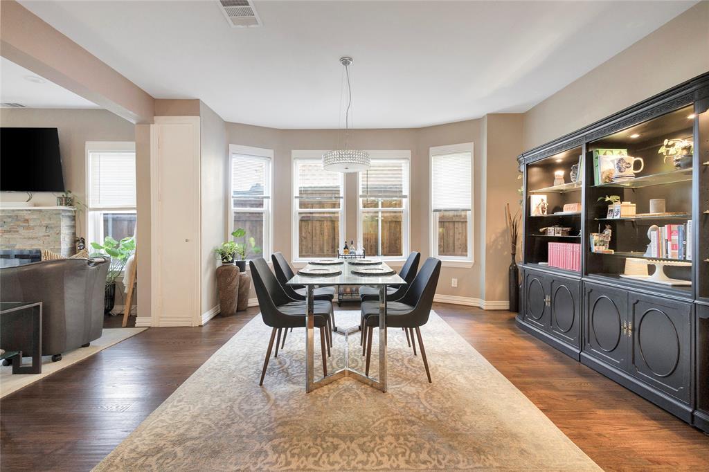 828 Elsbeth Street Dallas, TX 75208 - Photo 9 of 35 a dining room with furniture window wooden floor