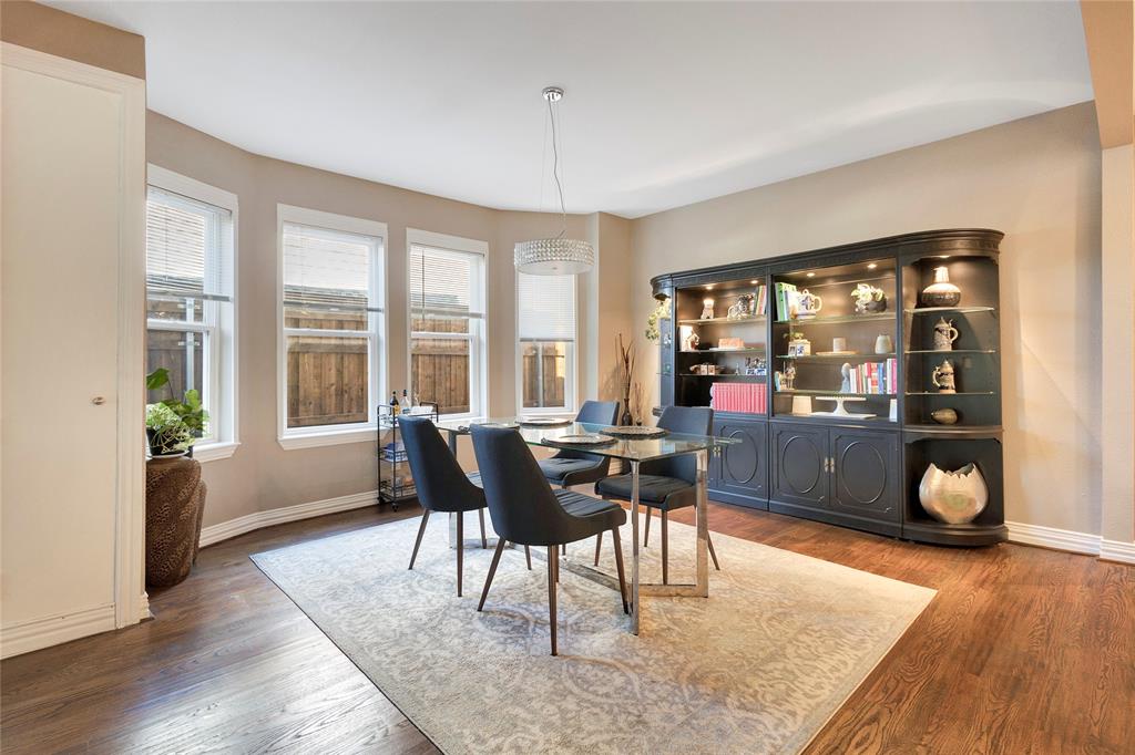 828 Elsbeth Street Dallas, TX 75208 - Photo 10 of 35 a living room with furniture and a wooden floor