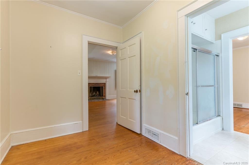 402 Chimney Rock Road Rutherfordton, NC 28139 - Photo 19 of 36 a view of a hallway with wooden floor and a bathroom