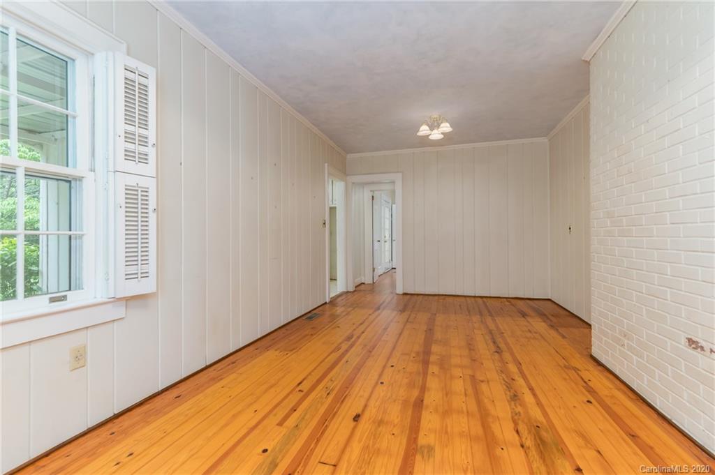 402 Chimney Rock Road Rutherfordton, NC 28139 - Photo 20 of 36 a view of empty room with wooden floor and fan