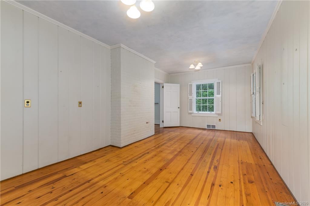 402 Chimney Rock Road Rutherfordton, NC 28139 - Photo 22 of 36 a view of a room with wooden floor and window