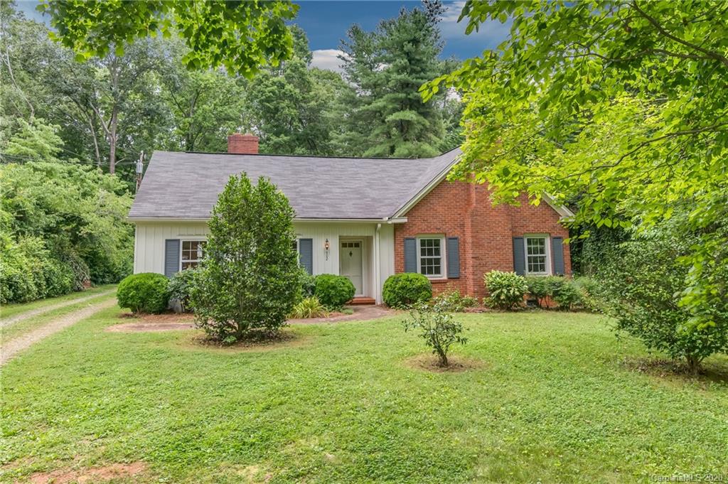 402 Chimney Rock Road Rutherfordton, NC 28139 - Photo 23 of 36 a front view of house with yard and green space