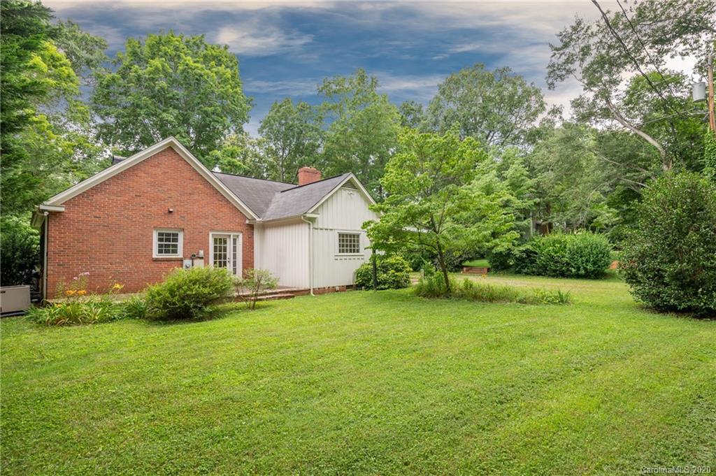 402 Chimney Rock Road Rutherfordton, NC 28139 - Photo 27 of 36 a front view of a house with yard and green space