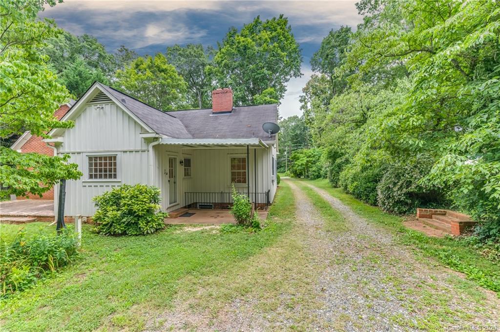 402 Chimney Rock Road Rutherfordton, NC 28139 - Photo 29 of 36 a view of a house with a yard and large tree