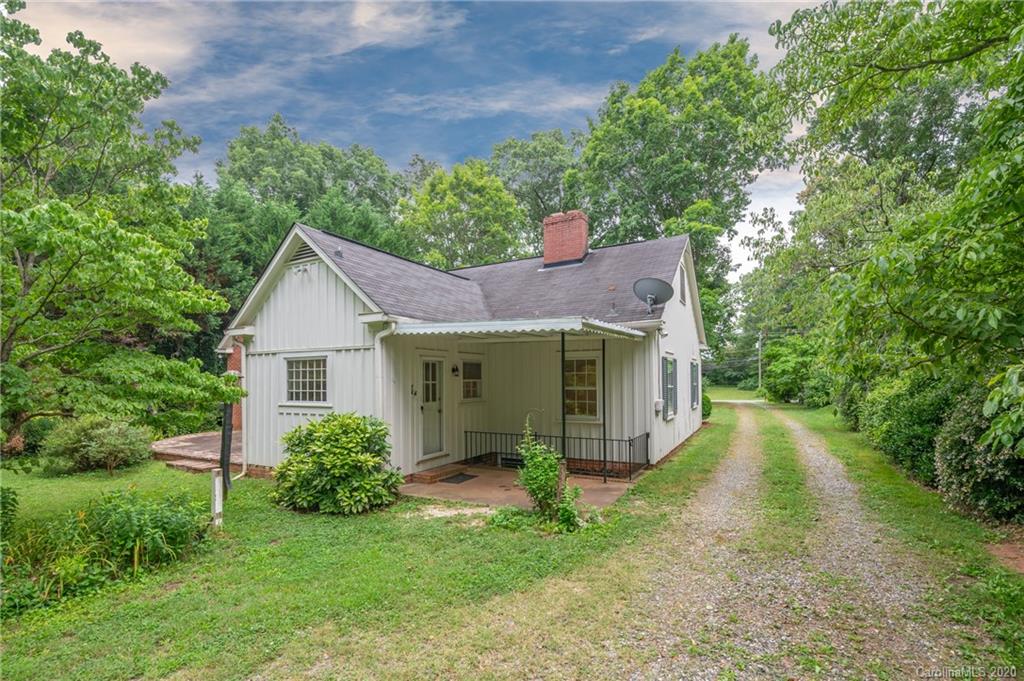 402 Chimney Rock Road Rutherfordton, NC 28139 - Photo 30 of 36 a view of a house with a yard and potted plants