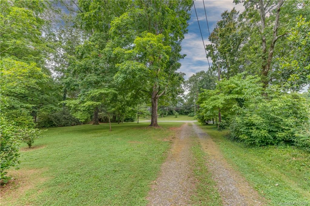 402 Chimney Rock Road Rutherfordton, NC 28139 - Photo 32 of 36 a view of a water pond with green yard