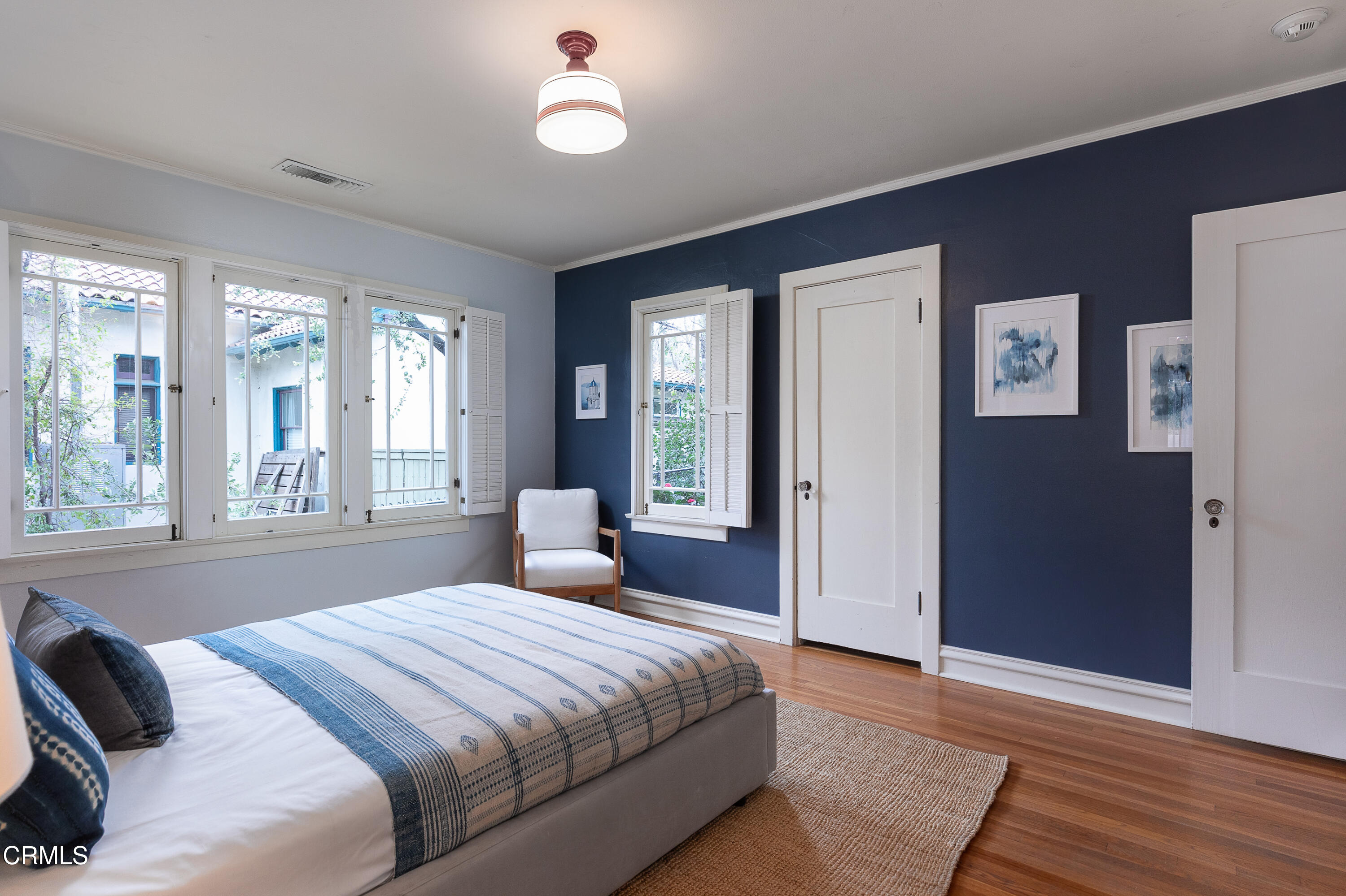 1083 Atchison Street Pasadena, CA 91104 - Photo 24 of 46 a bedroom with a bed and a large window