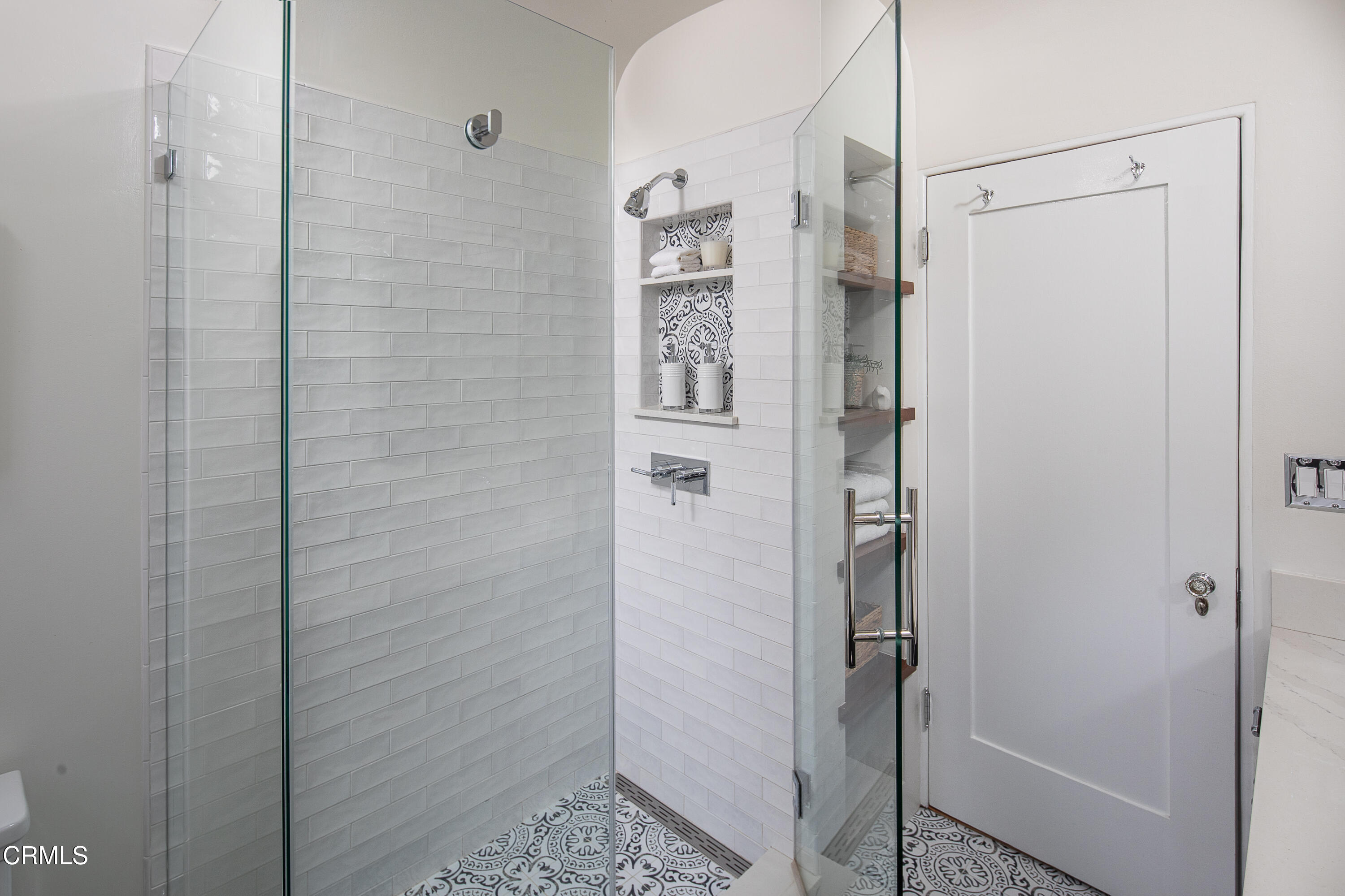 1083 Atchison Street Pasadena, CA 91104 - Photo 28 of 46 a bathroom with a shower and a glass door
