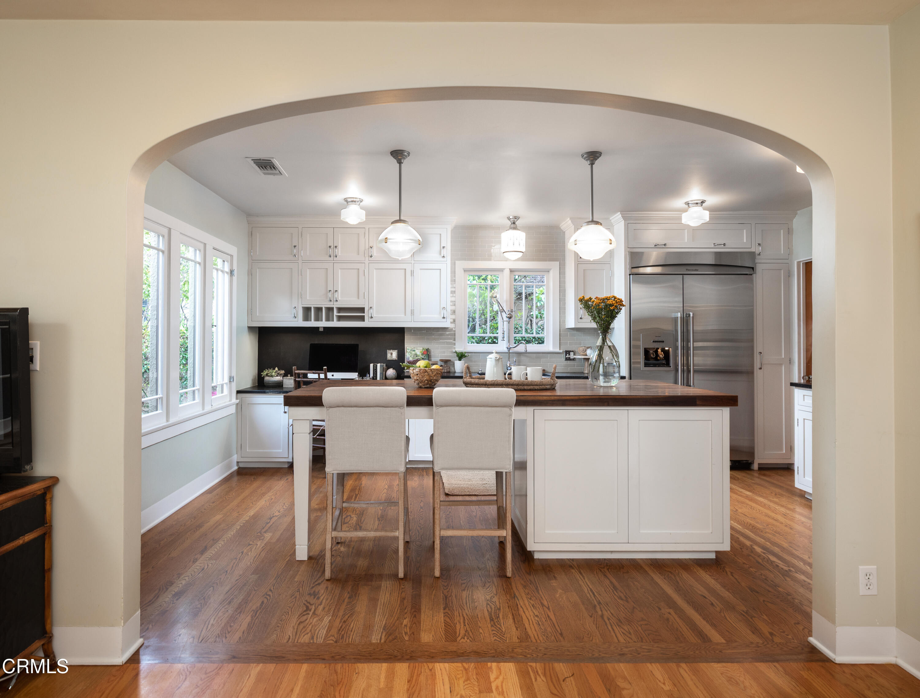 1083 Atchison Street Pasadena, CA 91104 - Photo 7 of 46 a kitchen with a sink cabinets and wooden floor
