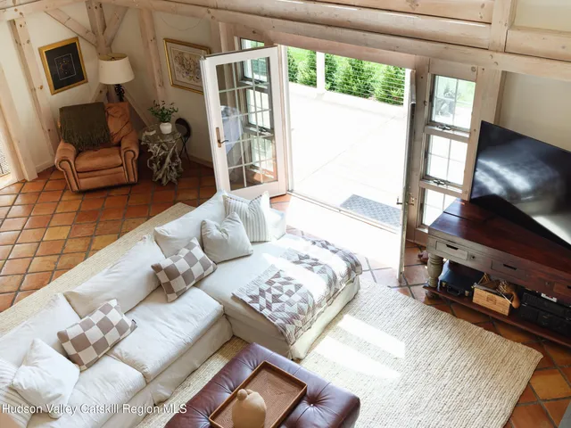 a view of a house with a backyard and trees
