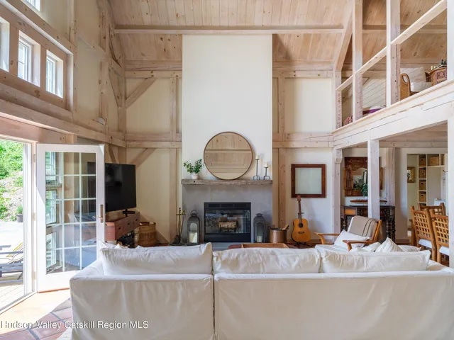 a living room with fireplace furniture and a fireplace