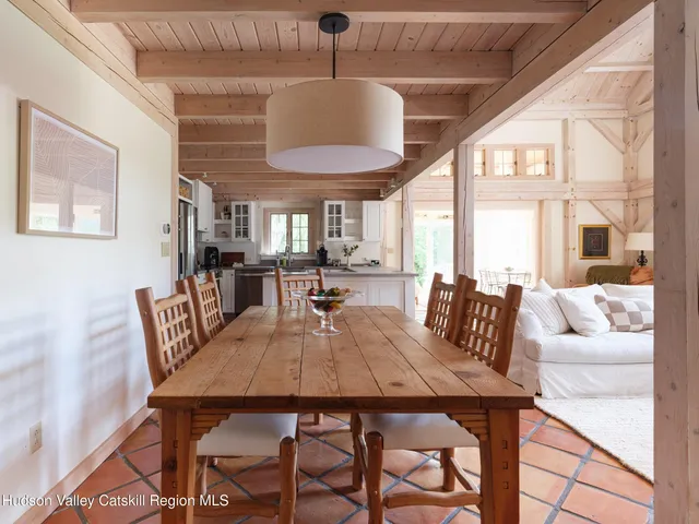 a view of a dining room with furniture wooden floor and chandelier