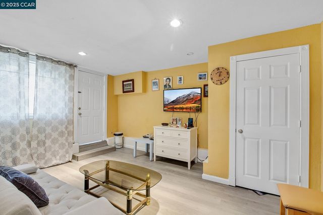 a living room with furniture and a table