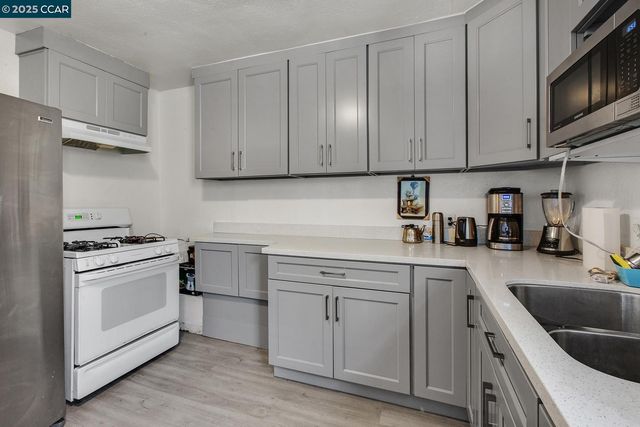 a bathroom with a sink toilet and window