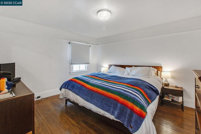 a bedroom with a bed and a lamp