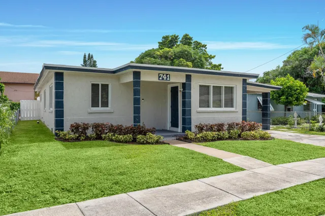 front view of a house with a yard