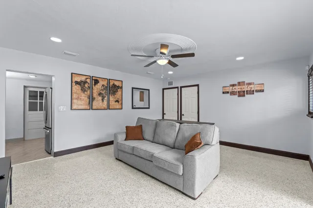 a bathroom with a sink mirror vanity and toilet