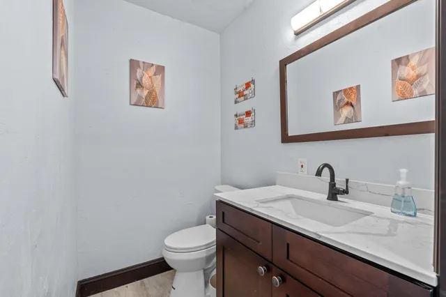 a view of a livingroom with furniture and a window