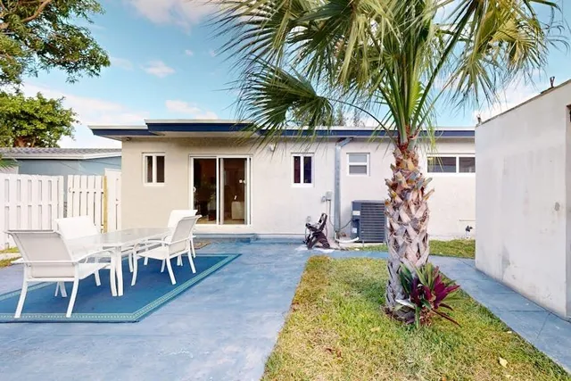 a bedroom with a bed and a ceiling fan