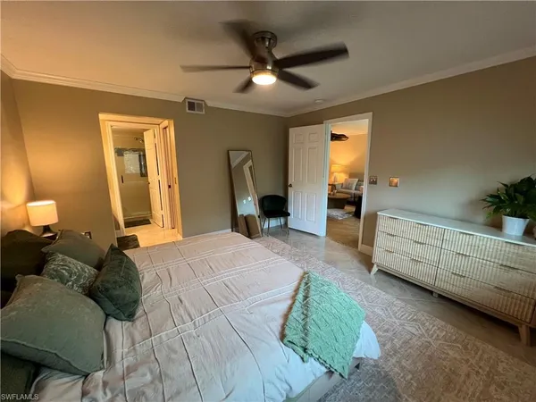 a bed room with a bed and a window