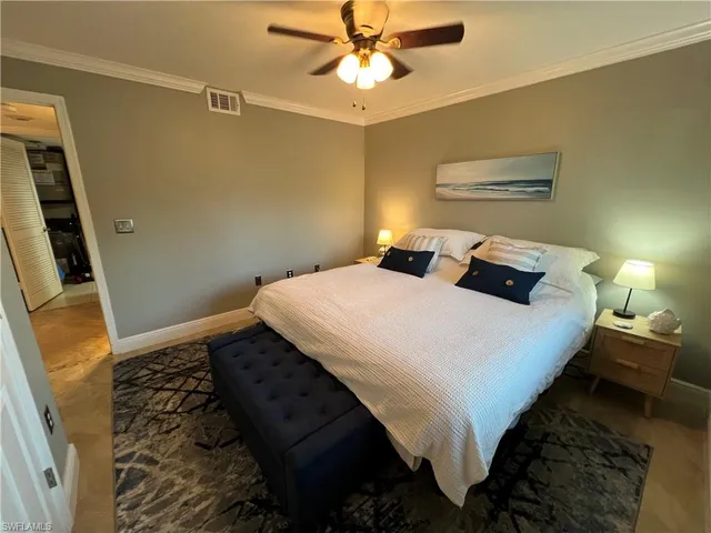 a bedroom with bed and a window