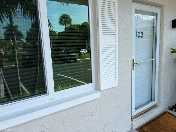 a view of a door and a window