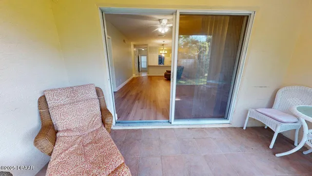 a view of workspace with furniture and wooden floor