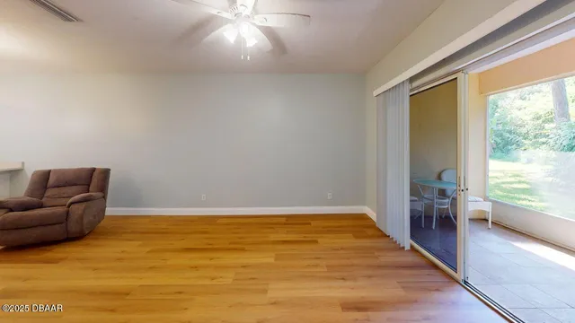 a view of livingroom with furniture and window