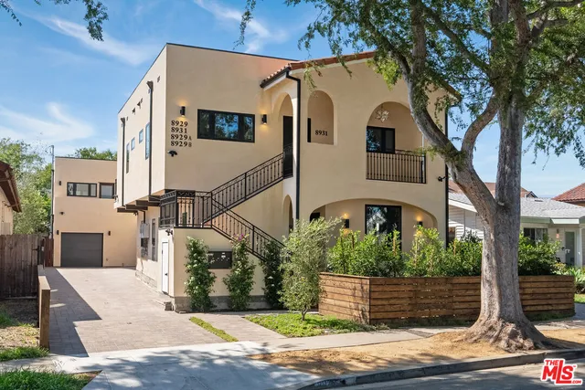 a front view of a house with garage