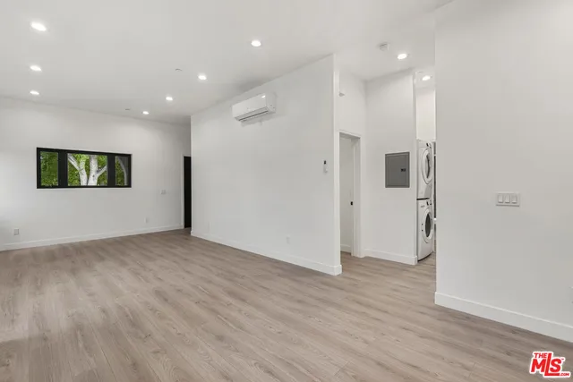 a view of hallway with wooden floor