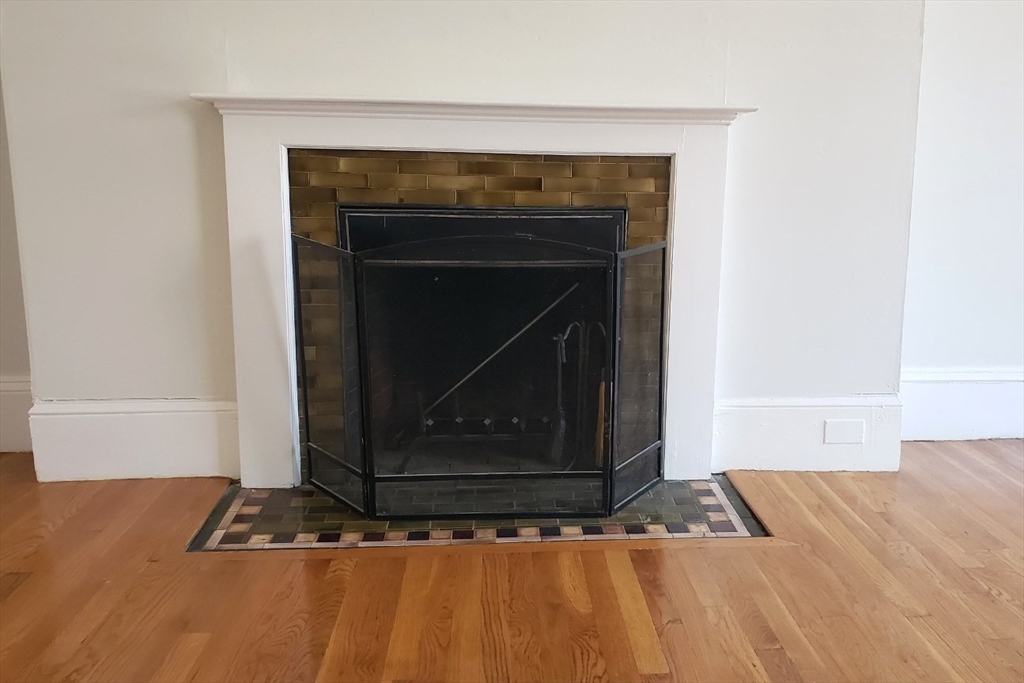 924 Beacon Street, Unit 6 Boston, MA 02215 - Photo 13 of 28 a living room with a fireplace