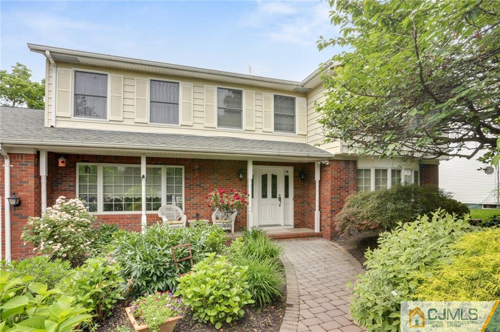 932 Inman Avenue, Unit 18 Edison, NJ 08820 - Photo 1 of 1 front view of a brick house with a large window