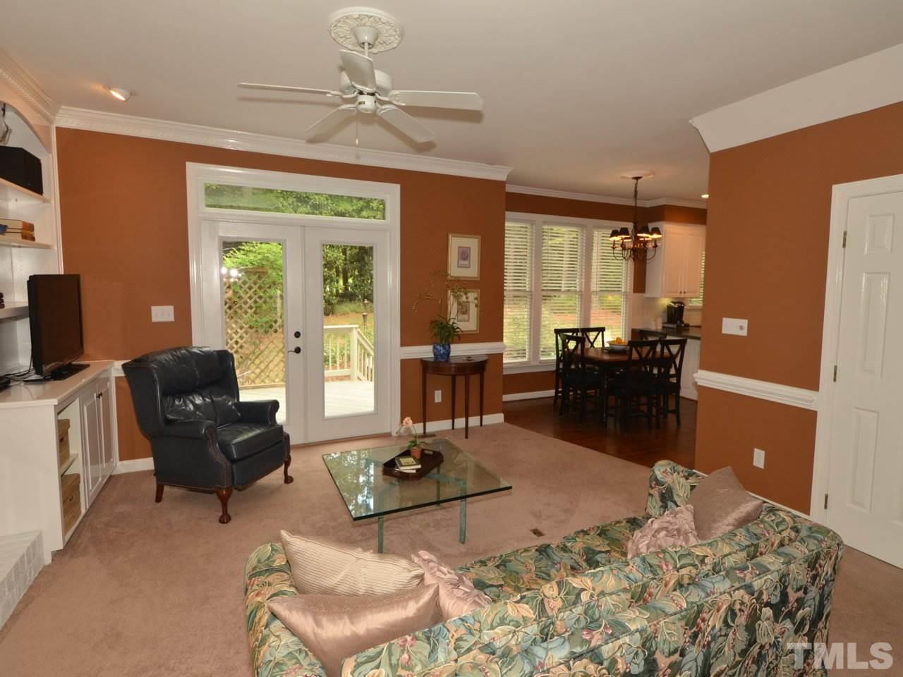 716 Presnell Court Raleigh, NC 27615 - Photo 8 of 25 a living room with furniture rug and a table