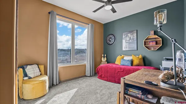 a view of a balcony next to a yard