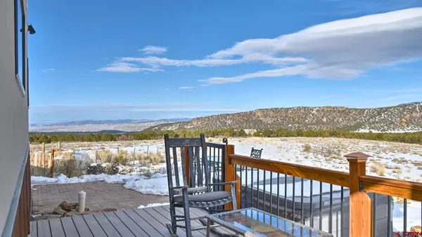 a view of a house with a snow in the yard