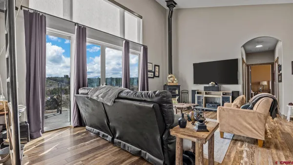 a kitchen with granite countertop a sink cabinets and stainless steel appliances