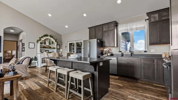 a view of a bathroom with a sink and a mirror