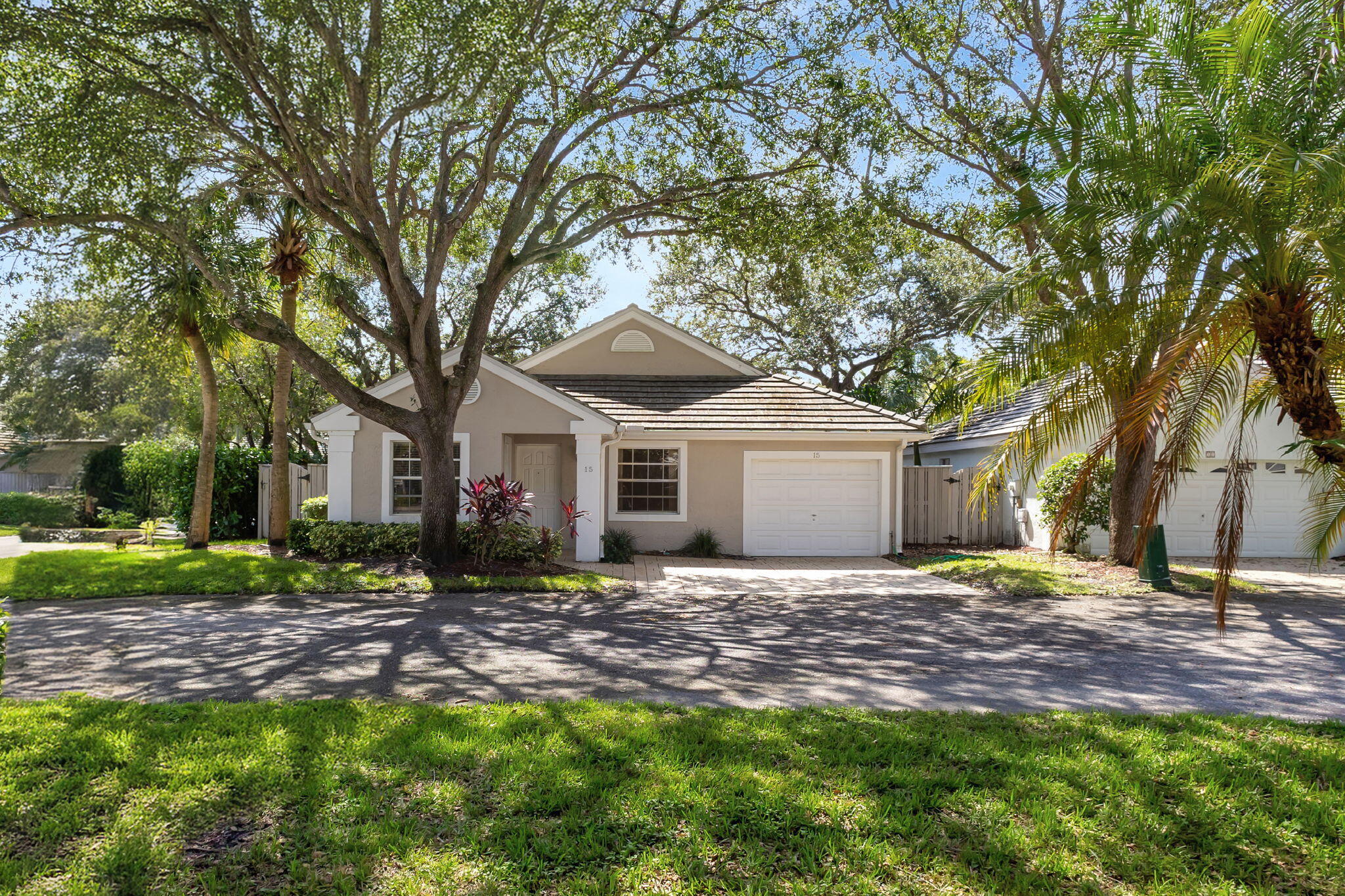 a house that has a tree in front of the house